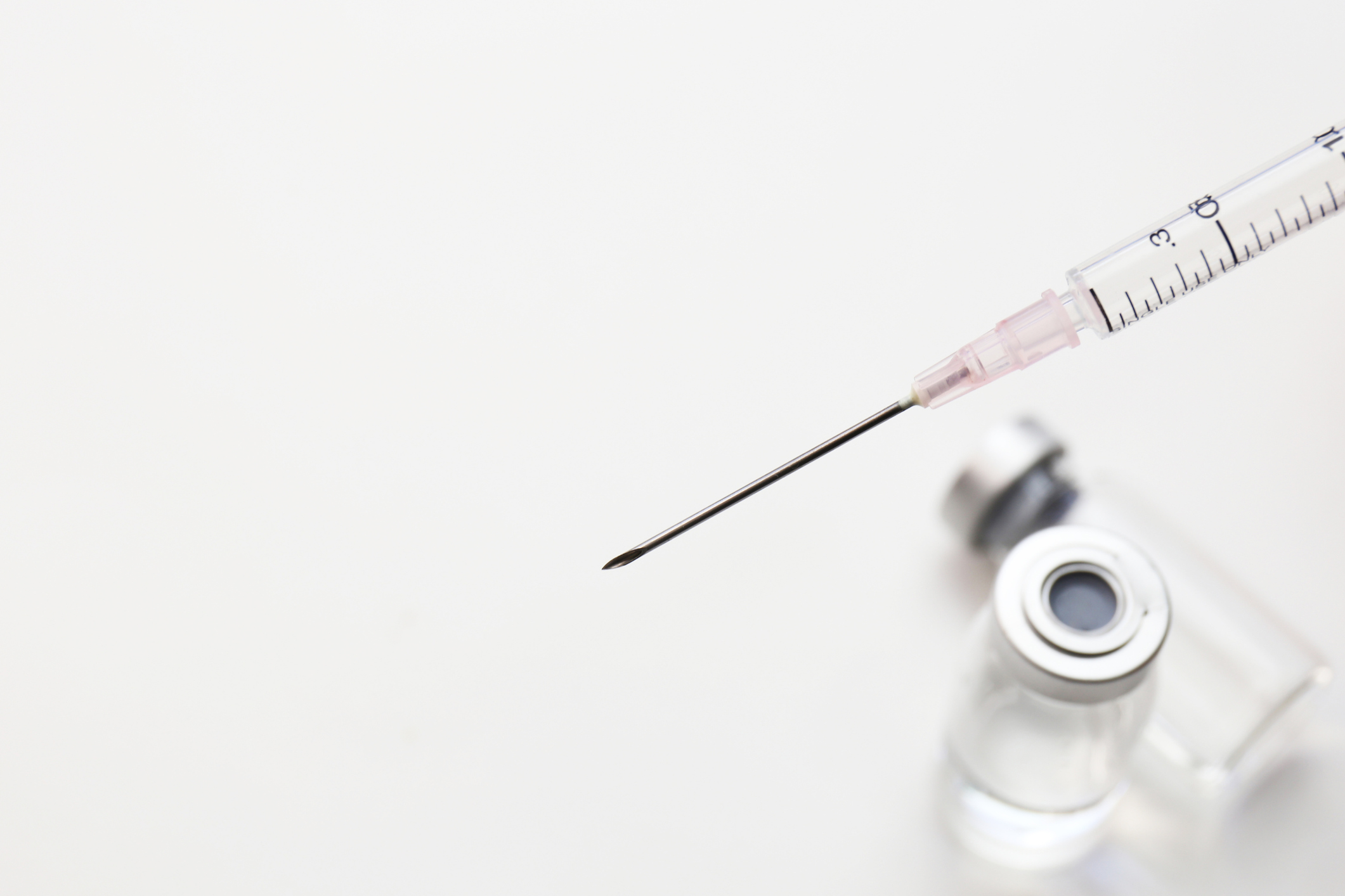 Image of medicine and syringe. Should you get the flu shot?