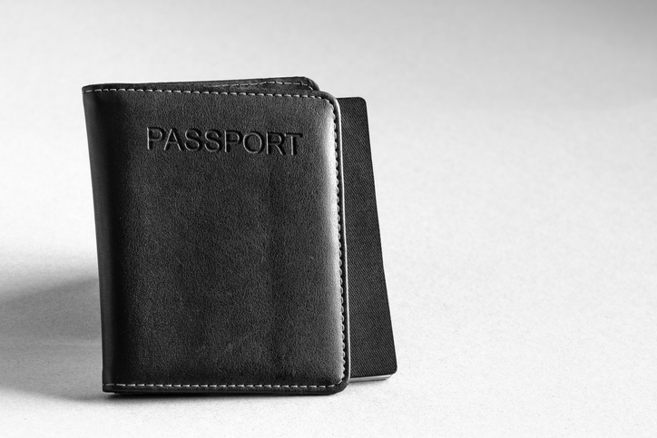 Black leather passport holder. 