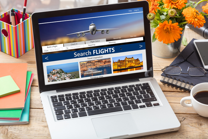Search for flights on a laptop computer.