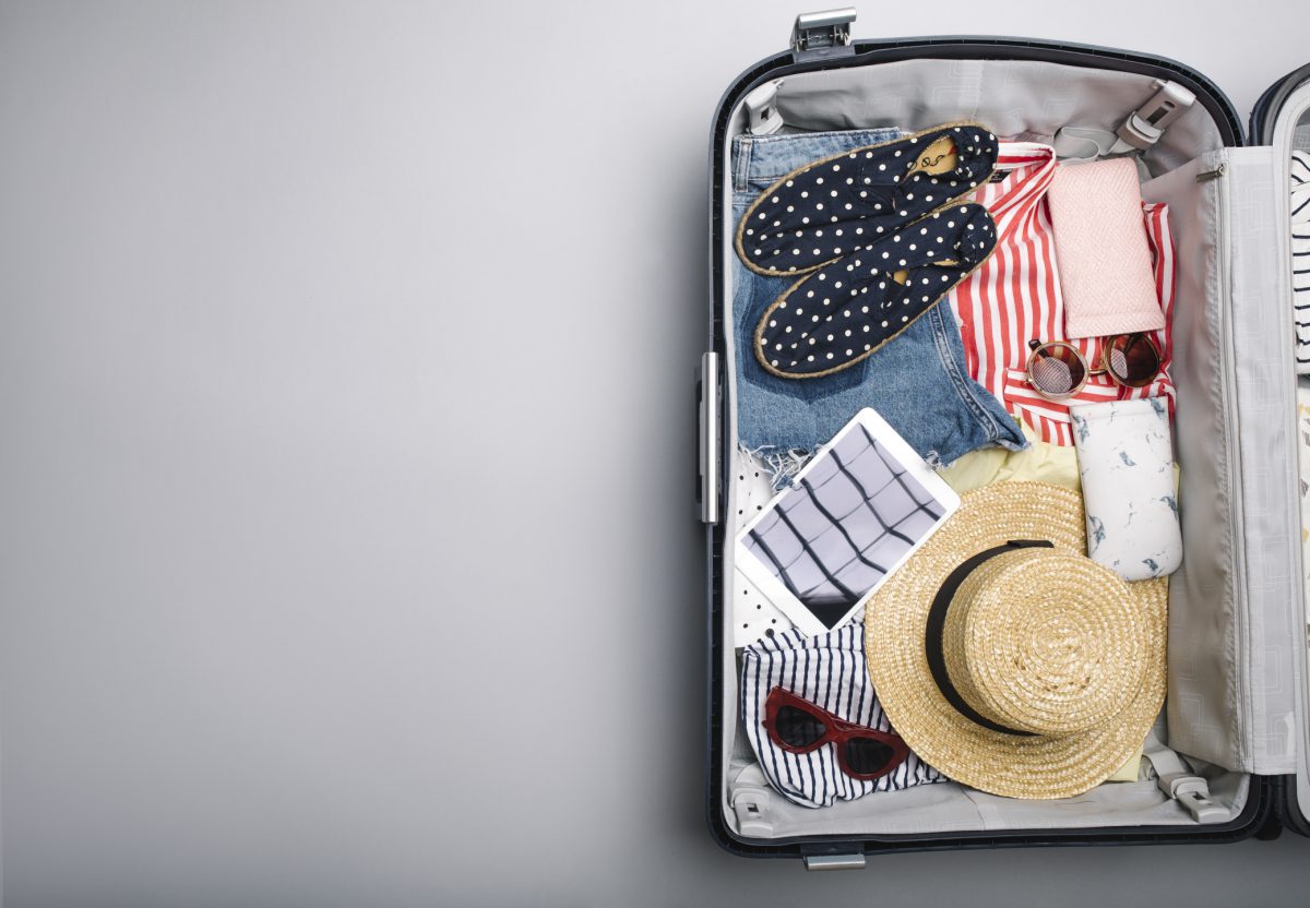 Carry on suitcase packed with essentials for travel.