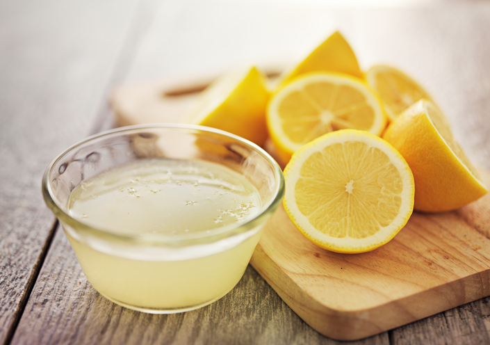 Lemon juice in small glass bowl. 