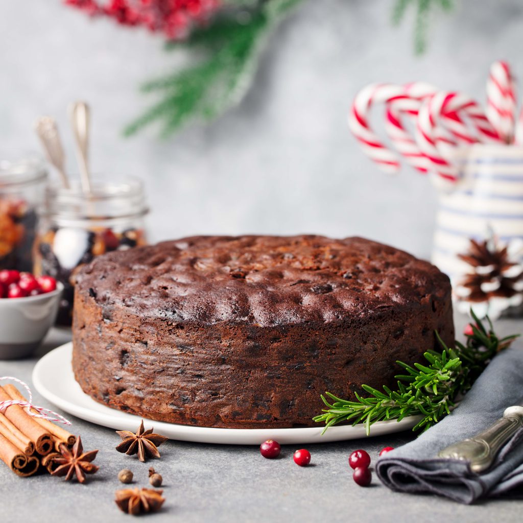 Findyello article on Caribbean Christmas recipes with image showing a fruit cake with garnish.