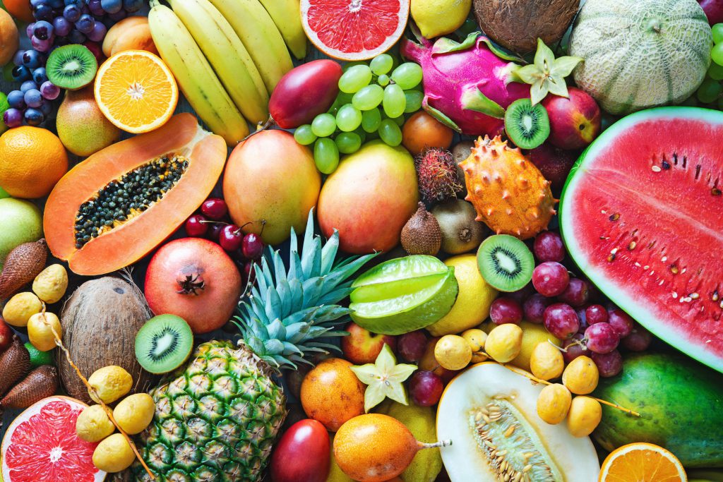 Findyello article 12 months of fruit image shows an assortment of tropical fruits.