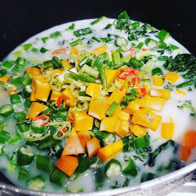 Cuisine Switch article on Trinidad Callaloo and Crab image of pot with veggies and coconut milk.