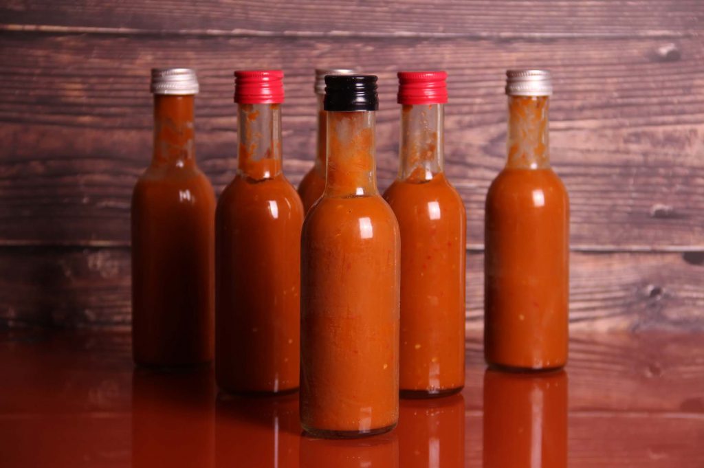 Hot pepper sauce on a table