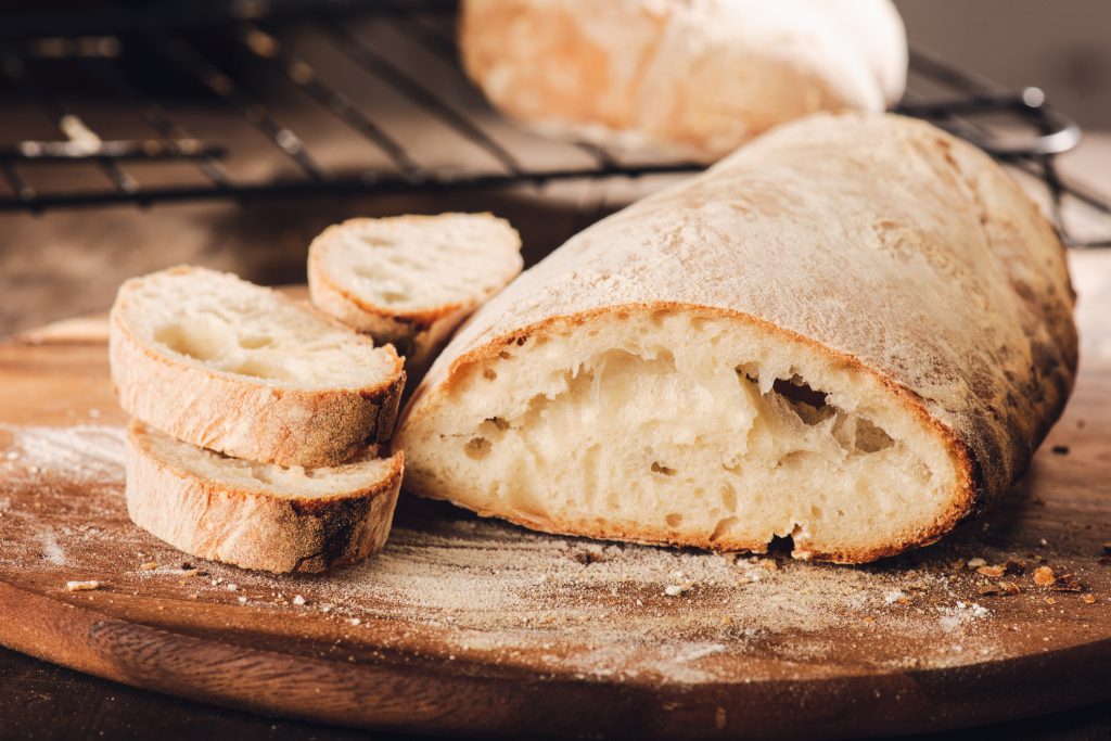 Findyello article on ole time Caribbean Christmas traditions with image of baked bread.