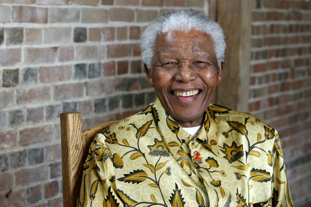 Findyello article on Nelson Mandela Day with image of South African President Nelson Mandela smiling,